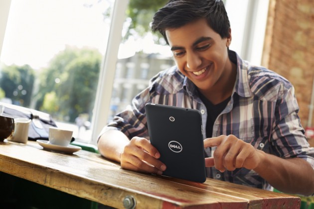 Young Man Using Venue 7 Tablet In A Cafe