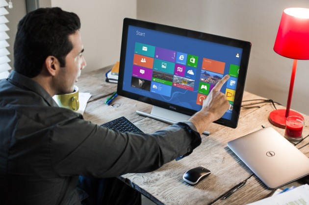 Man Using P2314T Monitor at Desk